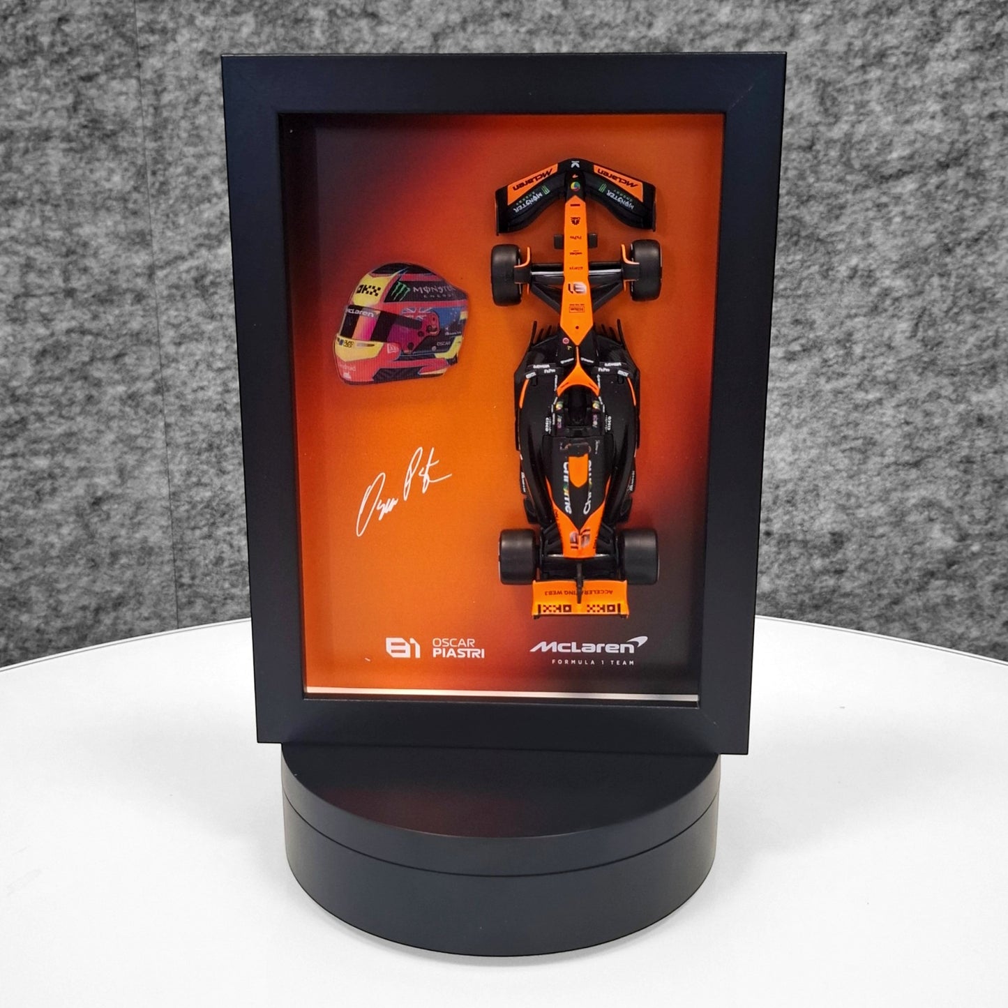 Oscar Piastri #81 - F1 Frame with McLaren 1:43 Scale Car, 3D Helmet and Signature